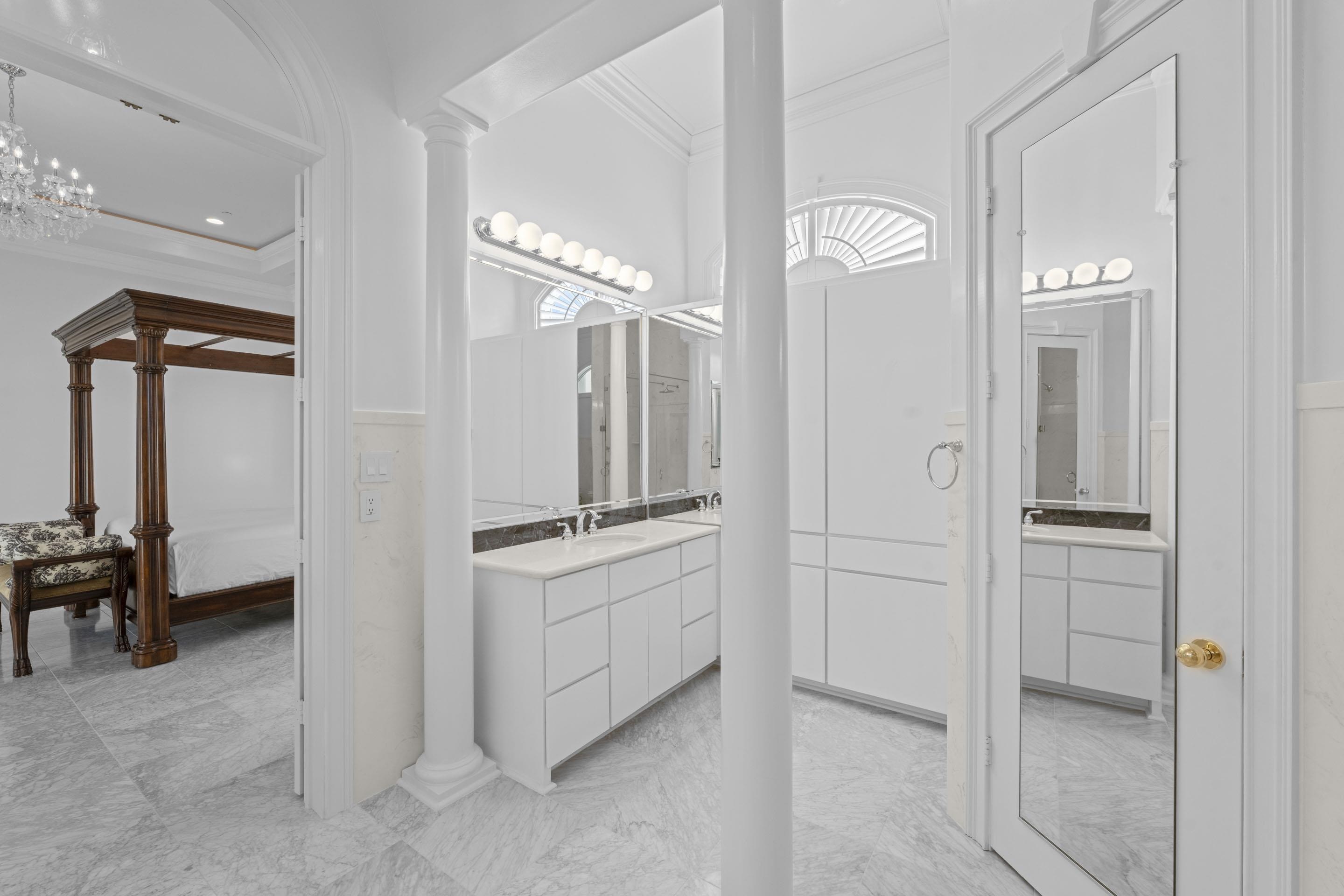 881 Bray Station Road Collierville, TN 38017 - Photo 23 of 40 a bathroom with a granite countertop sink a mirror and a shower