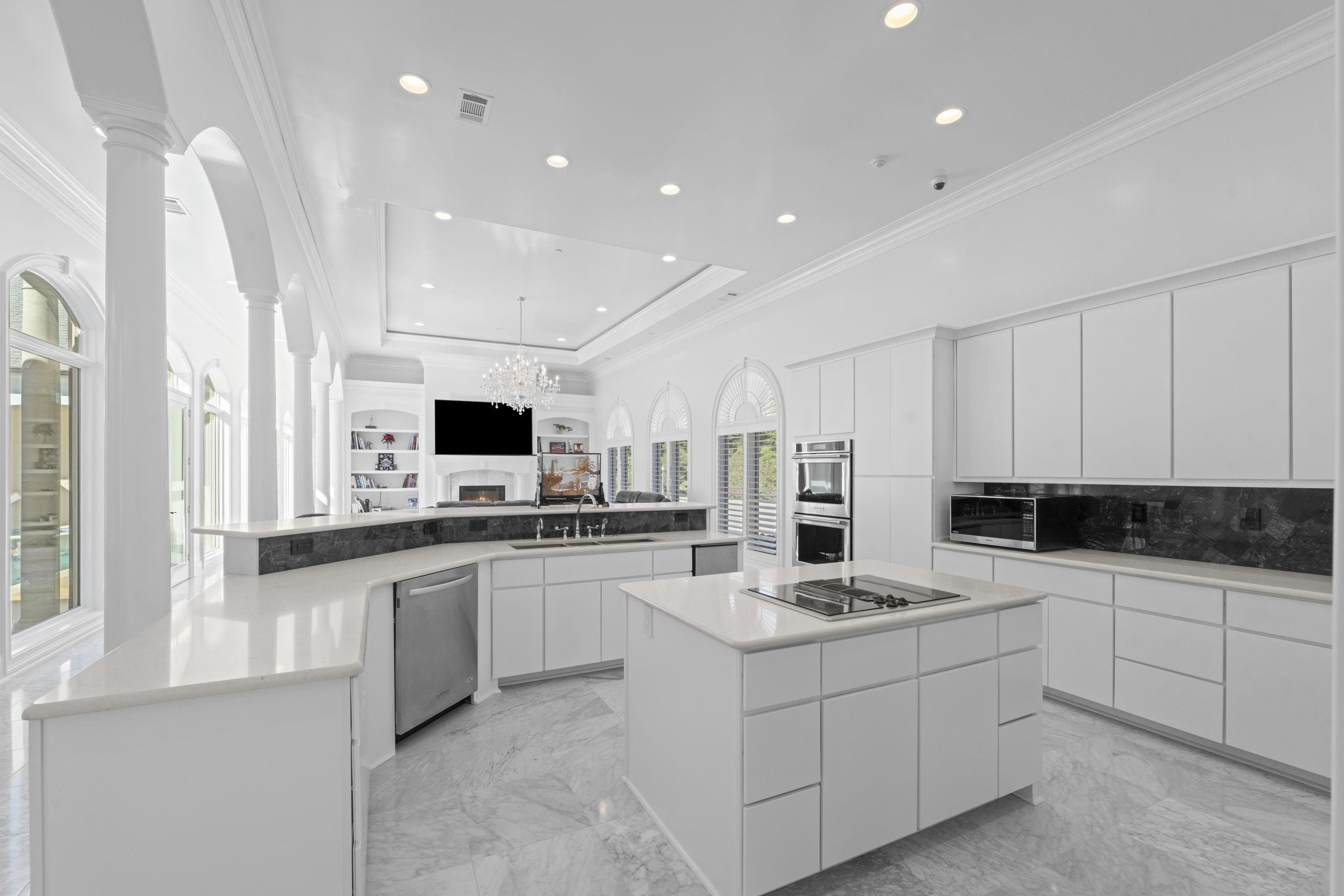 881 Bray Station Road Collierville, TN 38017 - Photo 38 of 40 a kitchen with stainless steel appliances kitchen island granite countertop a sink and cabinets