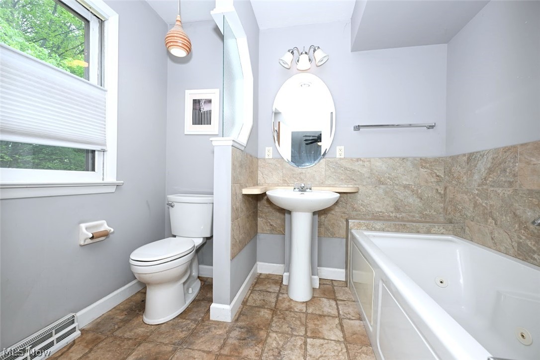 2987 Sourek Road Akron, OH 44333 - Photo 30 of 44 *MASTER BATHROOM W/JETTED TUB, TILE SURROUND, PENDANT LIGHTING, WALK IN SHOWER ~