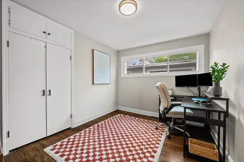 a workspace with furniture and window
