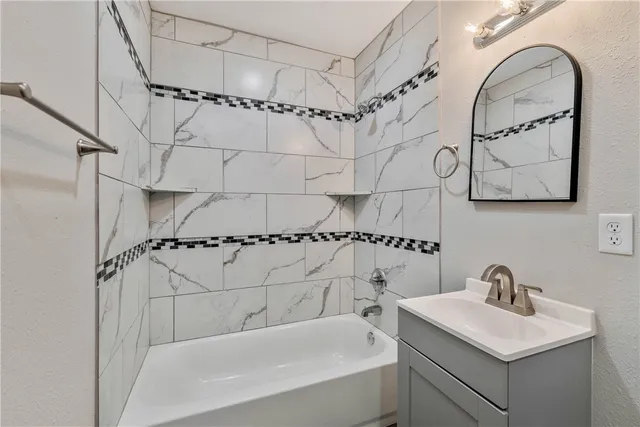 a bathroom with a sink and a bathtub