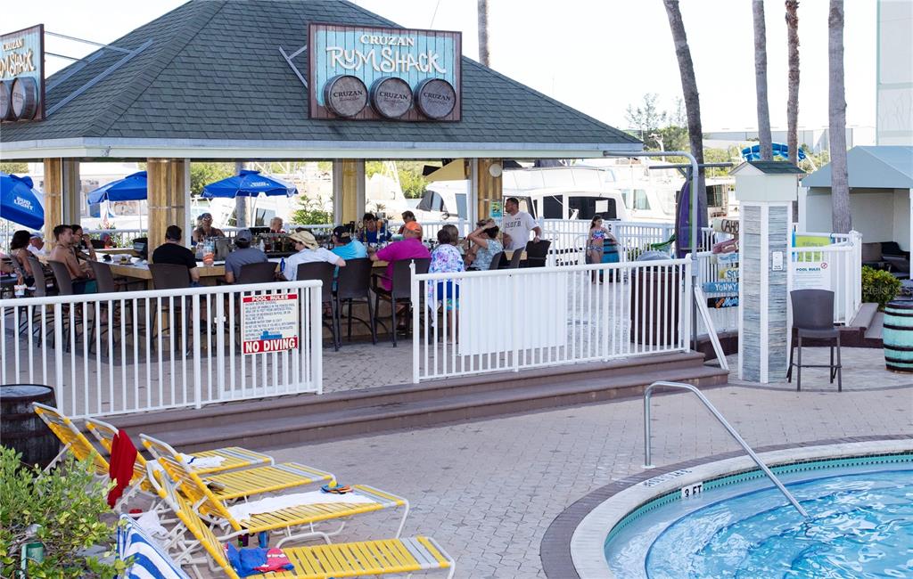 399 2nd Street, Unit 417 Indian Rocks Beach, FL 33785 - Photo 30 of 35 a store with outdoor seating and dining table