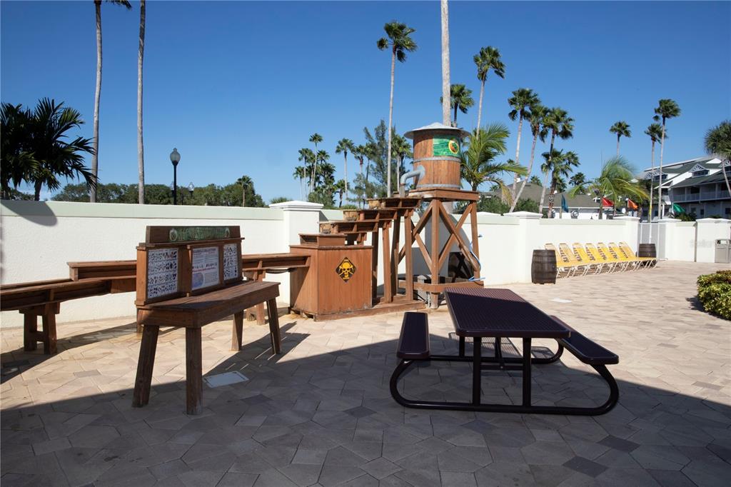 399 2nd Street, Unit 417 Indian Rocks Beach, FL 33785 - Photo 31 of 35 a view of a swimming pool with chairs