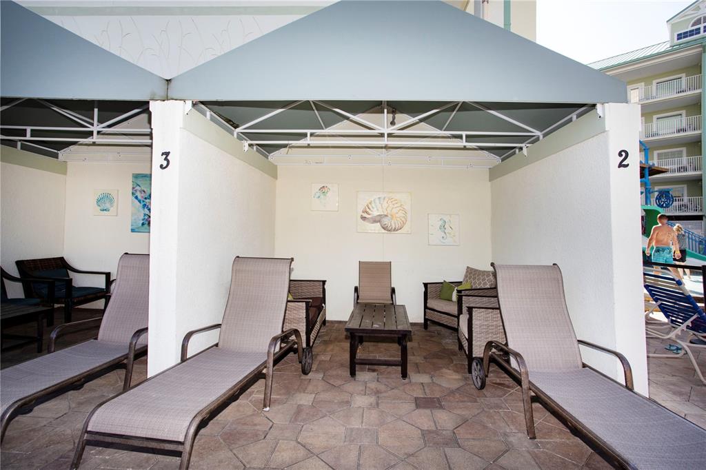 399 2nd Street, Unit 417 Indian Rocks Beach, FL 33785 - Photo 35 of 35 a bedroom with a bed and a ceiling fan