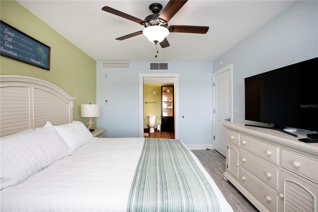 399 2nd Street, Unit 417 Indian Rocks Beach, FL 33785 - Photo 9 of 35 a bedroom with a bed and a flat screen tv