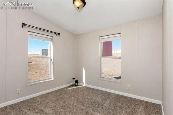 an aerial view of a couch with wooden floor