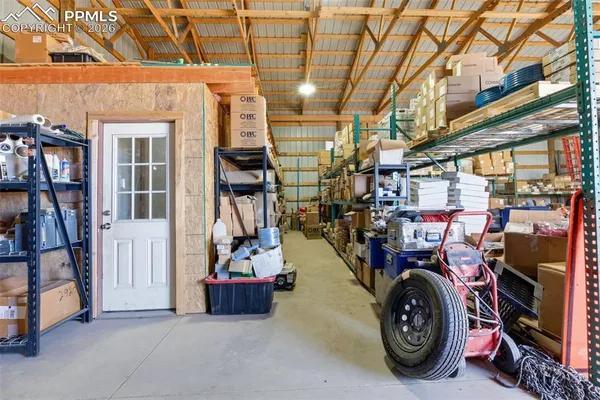 a view of a garage with cars