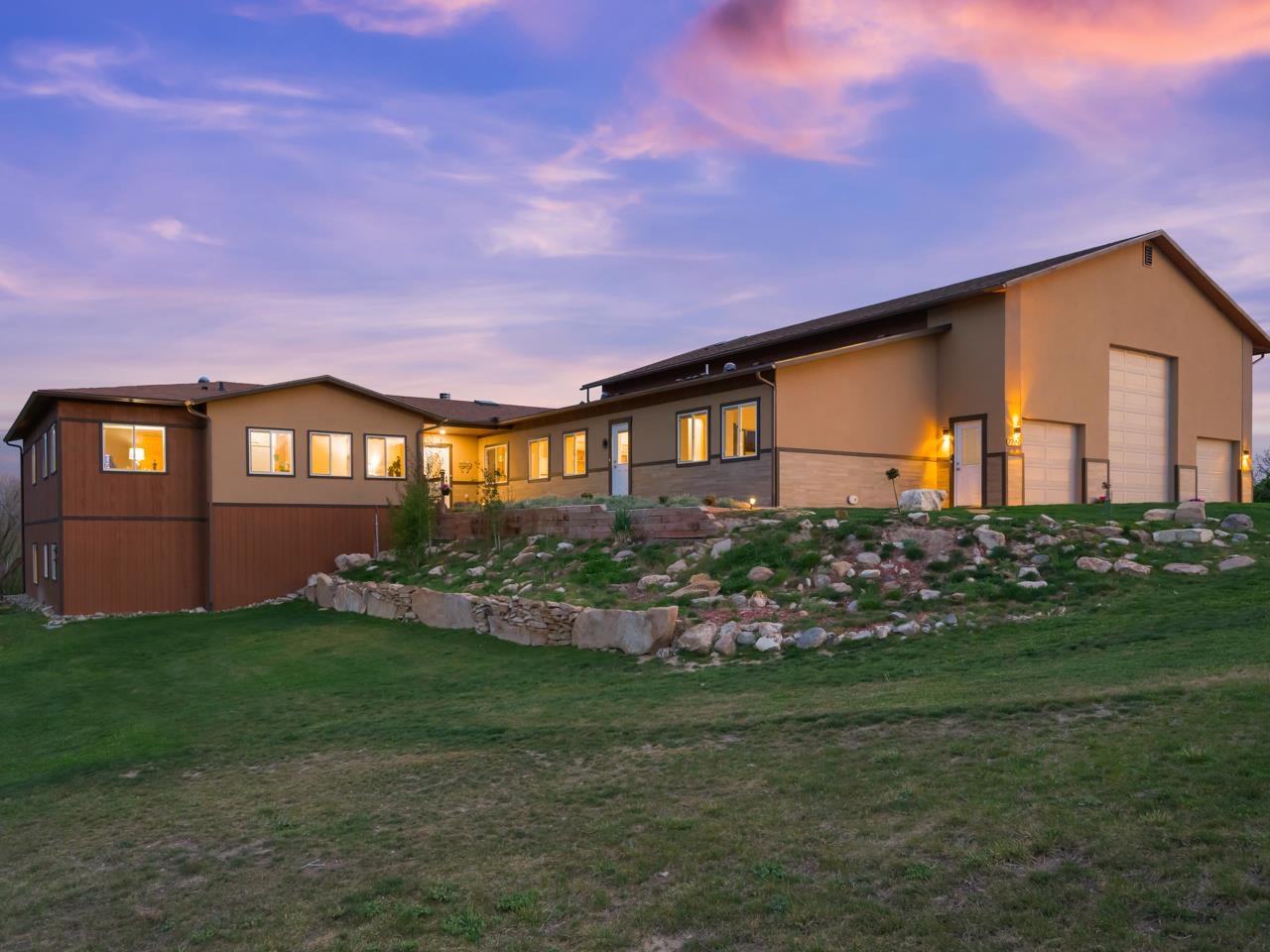 2209 Hatton Place Montrose, CO 81401 - Photo 1 of 42 a front view of a house with garden