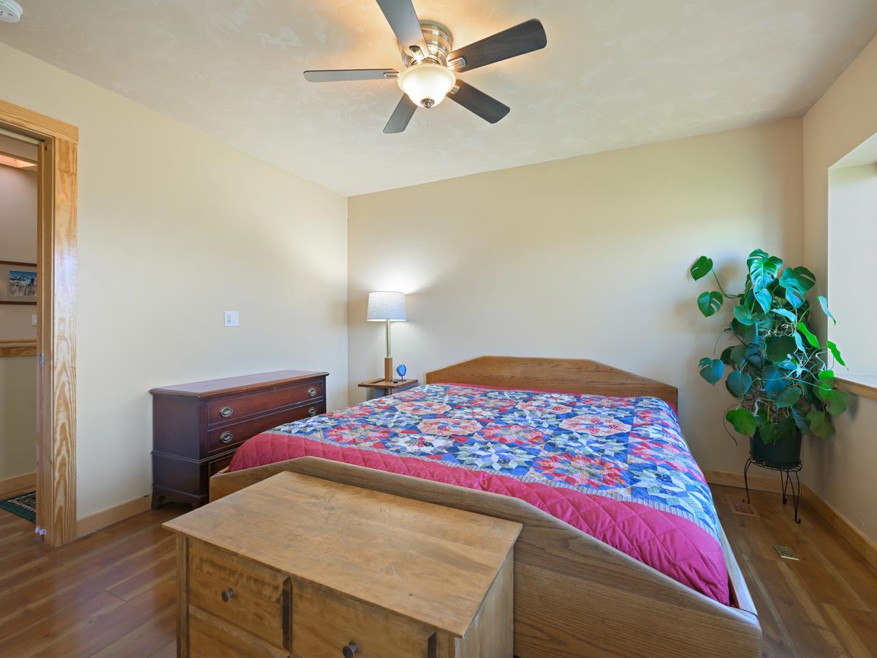 2209 Hatton Place Montrose, CO 81401 - Photo 22 of 42 a bedroom with a bed and a potted plant
