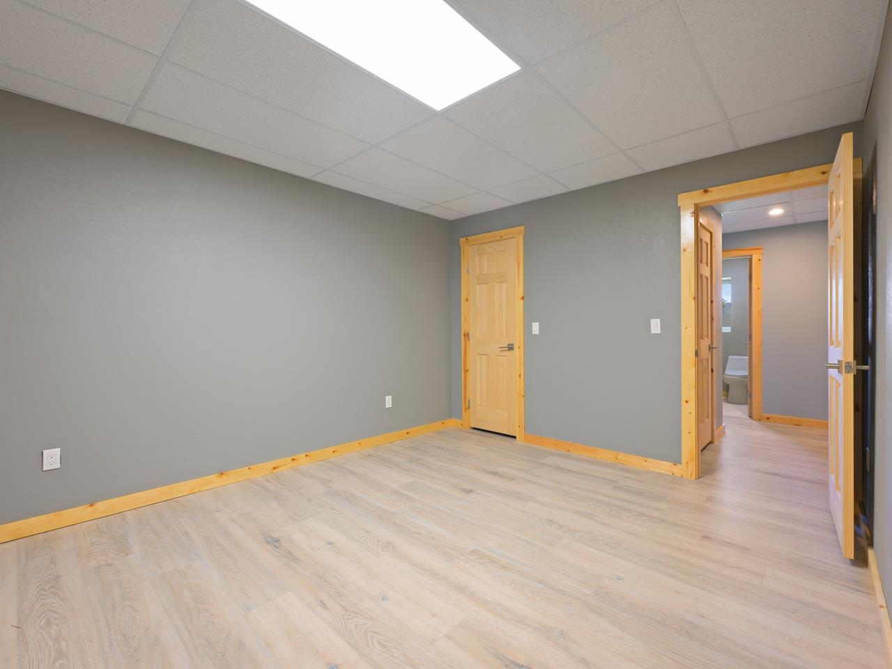 2209 Hatton Place Montrose, CO 81401 - Photo 34 of 42 a view of an empty room and wooden floor