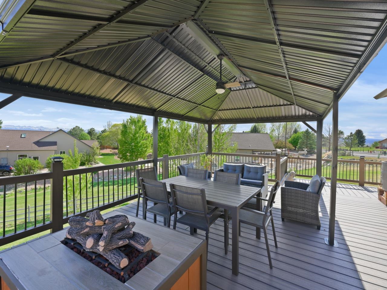 2209 Hatton Place Montrose, CO 81401 - Photo 41 of 42 a view of a patio with a table chairs and backyard