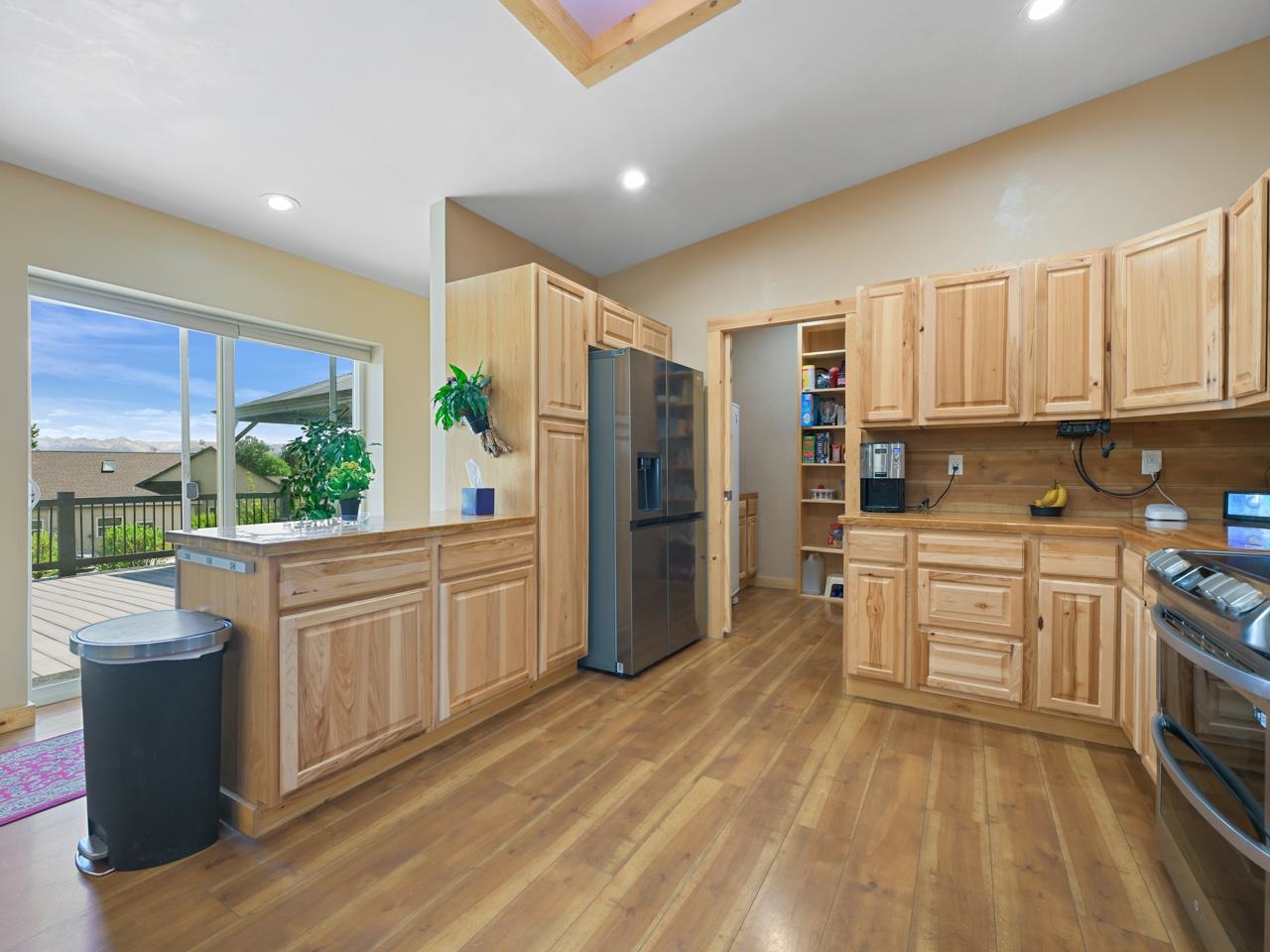 2209 Hatton Place Montrose, CO 81401 - Photo 10 of 42 a kitchen with stainless steel appliances granite countertop a refrigerator a stove and a sink with cabinets