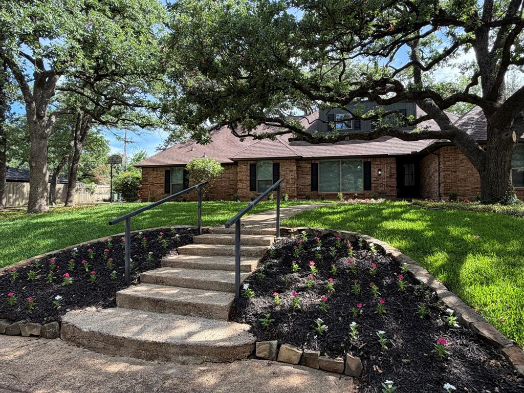 3609 Country Club Road Arlington, TX 76013 - Photo 2 of 40 a front view of a house with a yard