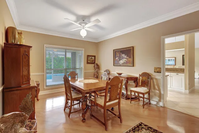 a utility room with cabinets washer and dryer