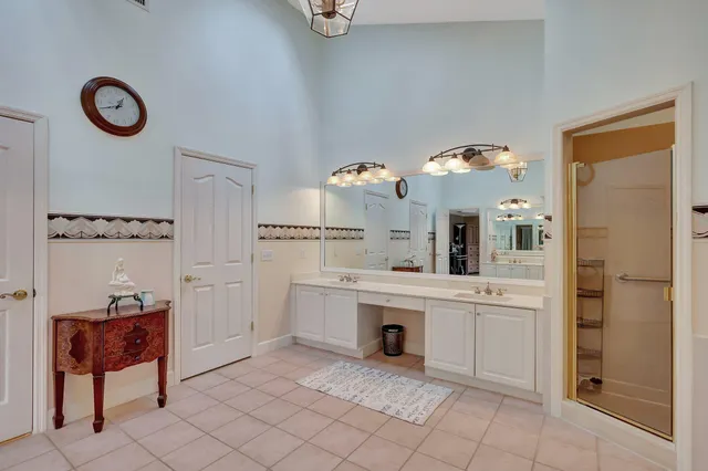 a kitchen with granite countertop a sink a stove cabinets and counter space