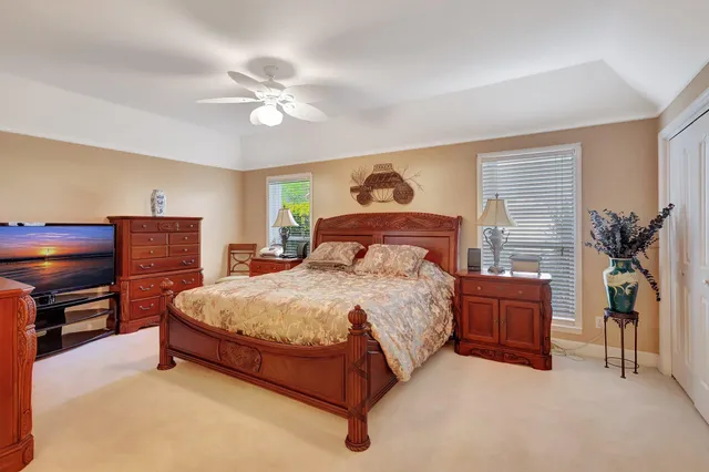 a spacious bathroom with a double vanity sink and mirror