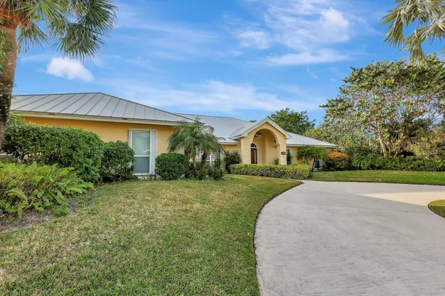 an aerial view of a house with outdoor space