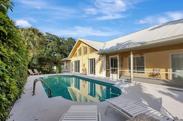 a view of a house with a yard balcony