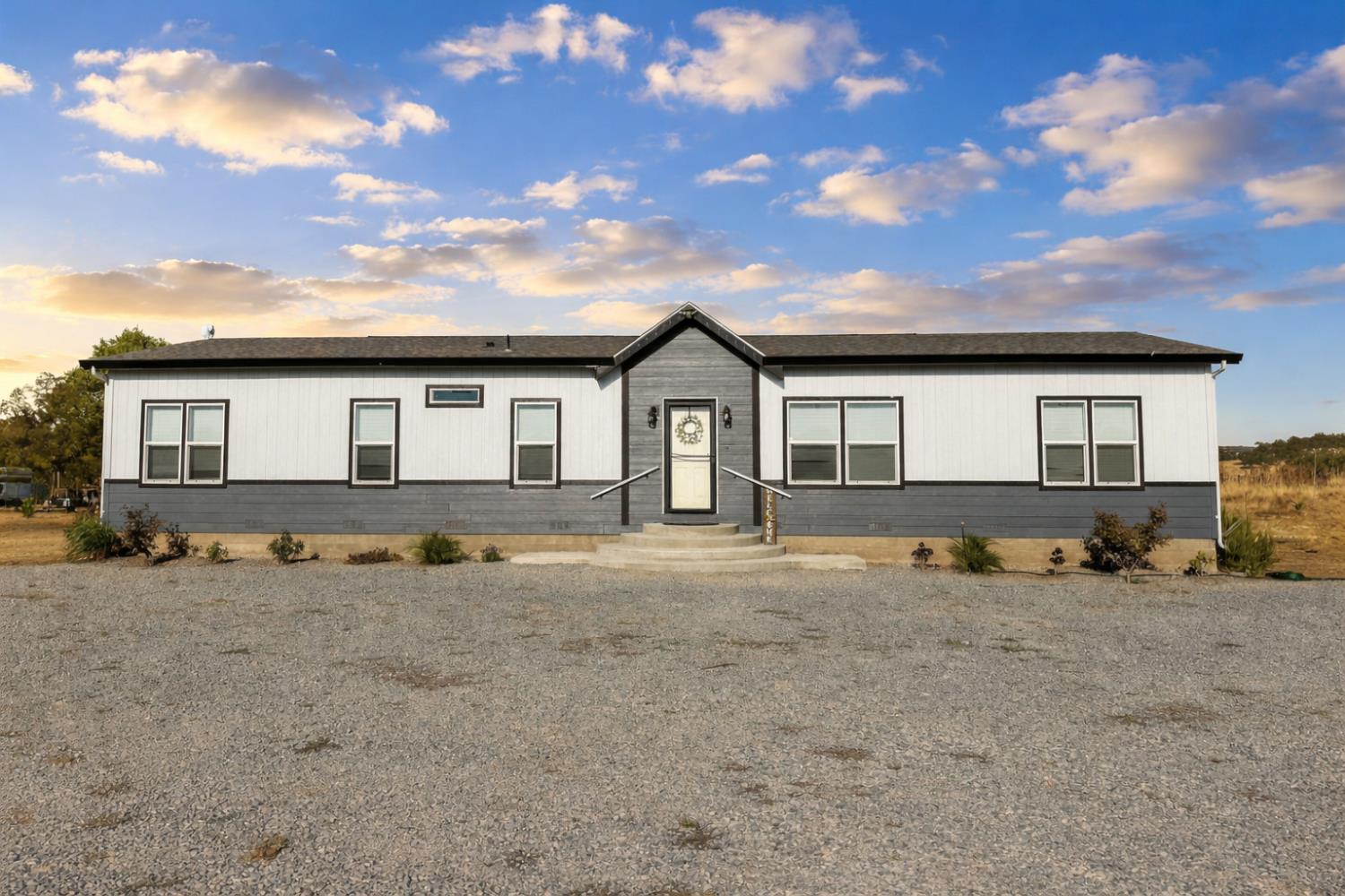 9881 Scenic Valley Road Valley Springs, CA 95252 - Photo 1 of 12 front view of a house with a patio