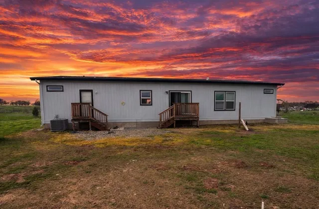 a house view with a backyard space