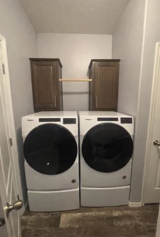 a utility room with dryer and washer