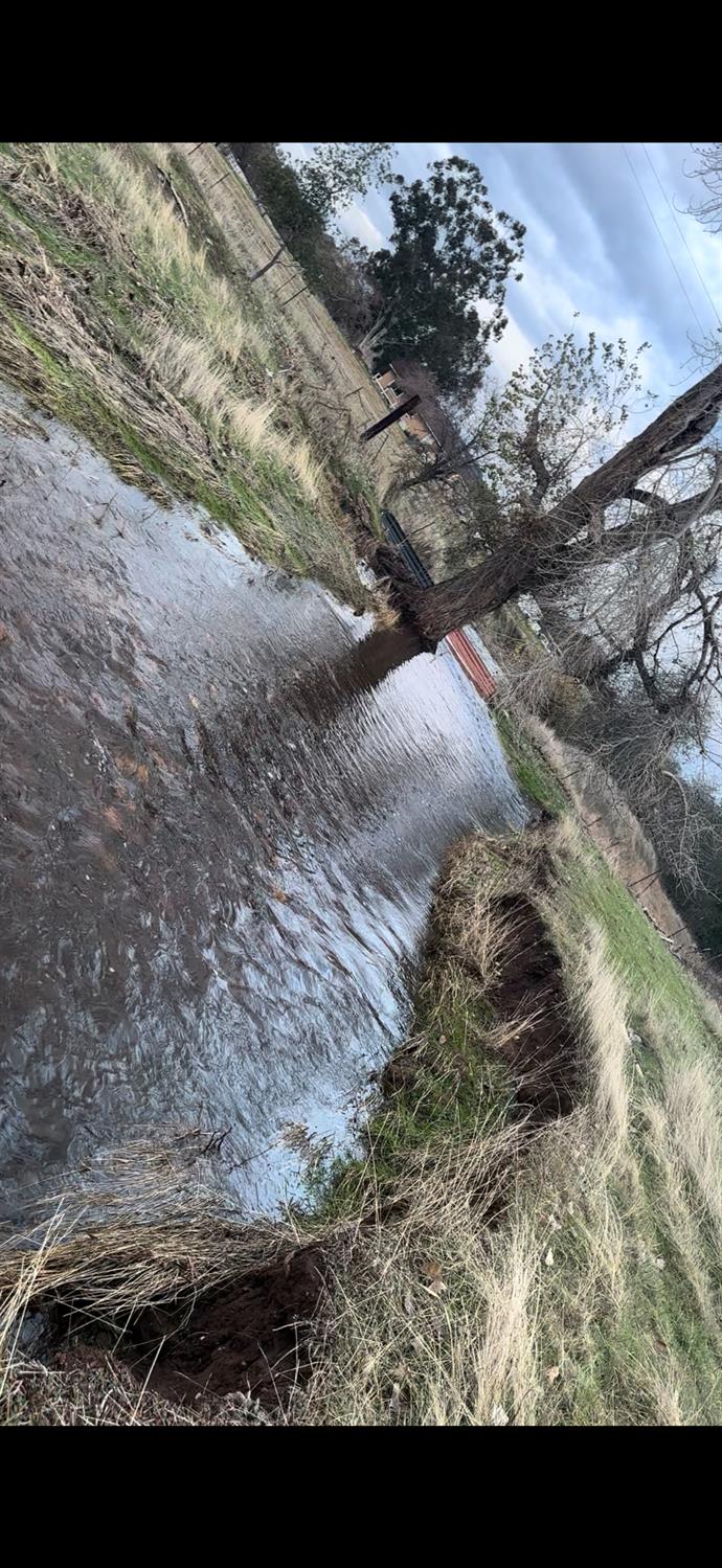 9881 Scenic Valley Road Valley Springs, CA 95252 - Photo 8 of 12 a view of a dry yard with wooden fence