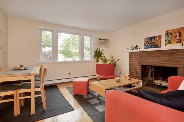7-9 Sparkill Street Watertown, MA 02472 - Photo 17 of 27 a living room with furniture fireplace and window