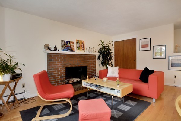 7-9 Sparkill Street Watertown, MA 02472 - Photo 18 of 27 a living room with furniture fireplace and rug