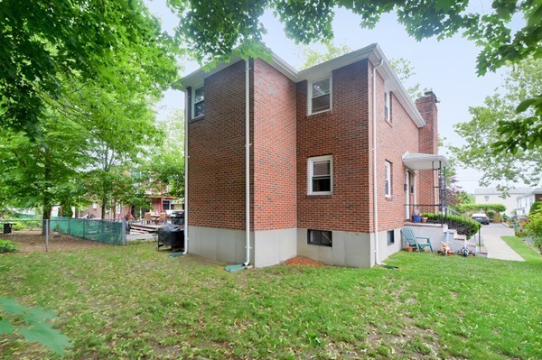 7-9 Sparkill Street Watertown, MA 02472 - Photo 4 of 27 a backyard of a house with seating space