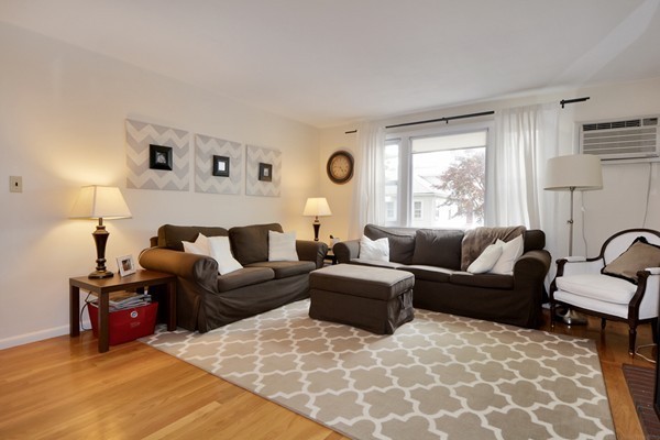 7-9 Sparkill Street Watertown, MA 02472 - Photo 7 of 27 a living room with furniture and a large window
