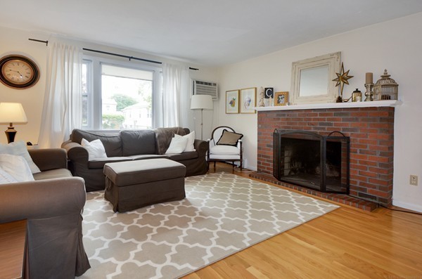 7-9 Sparkill Street Watertown, MA 02472 - Photo 8 of 27 a living room with furniture and a fireplace