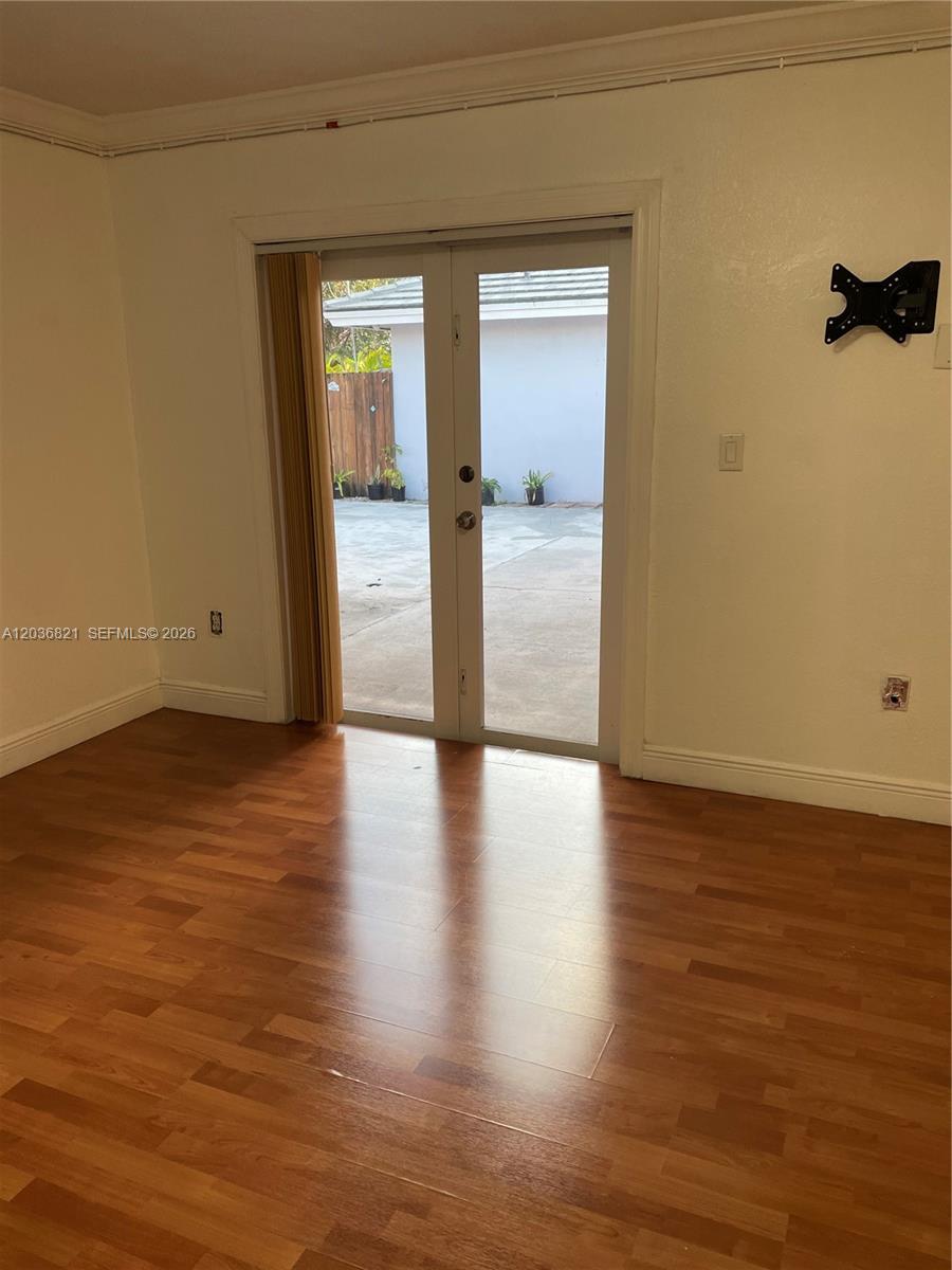 14770 Southwest 60th Street Miami, FL 33193 - Photo 7 of 16 a view of a room with wooden floor and a window