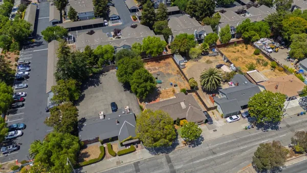 an aerial view of a houses with outdoor space