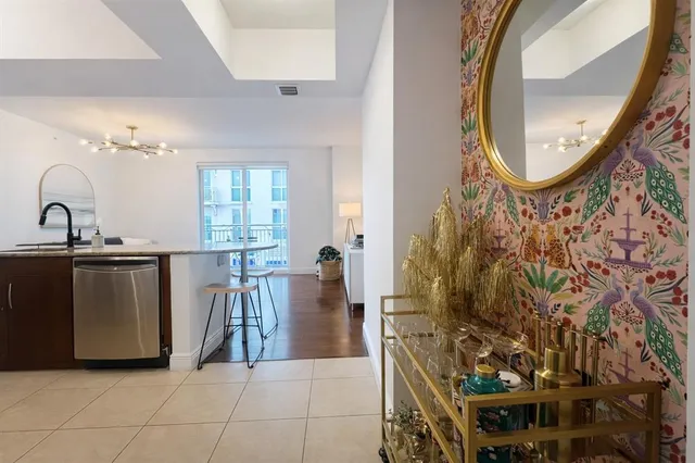 a kitchen with a sink cabinets and wooden floor