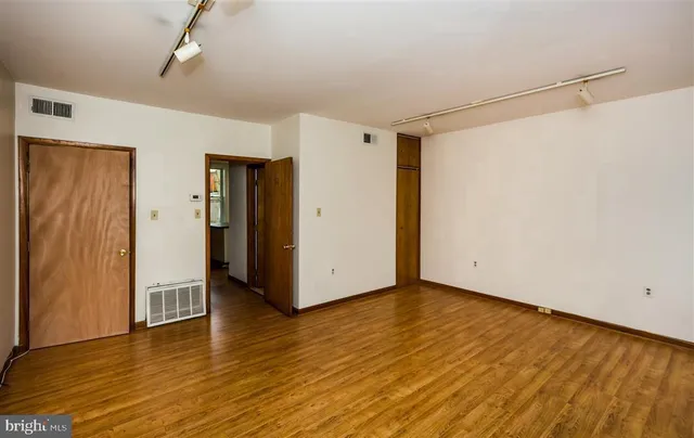 a kitchen with granite countertop a stove and a microwave