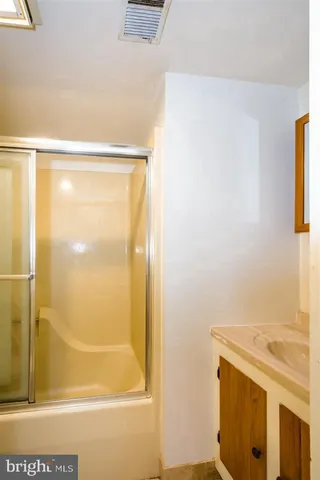 a view of an empty room with a fireplace