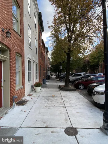 a view of street with parked cars