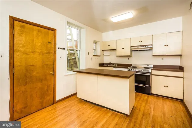 a bathroom with a shower and a sink