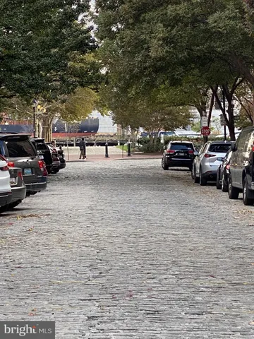 a view of street with parked cars