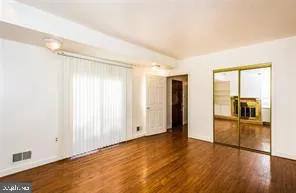 a view of a room with wooden floors and pool