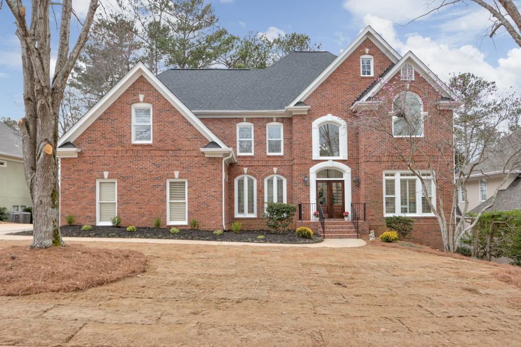 a front view of a house with a yard