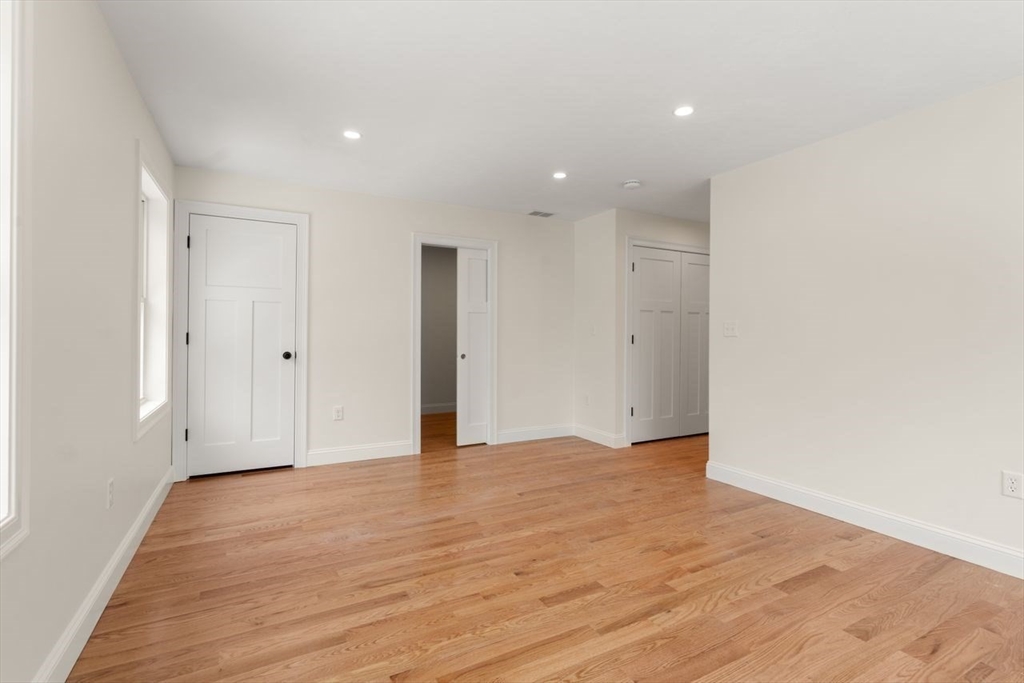 52 Freeman Street Avon, MA 02322 - Photo 11 of 17 a view of an empty room with wooden floor