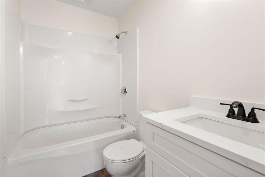 52 Freeman Street Avon, MA 02322 - Photo 12 of 17 a bathroom with a sink a toilet and a bathtub