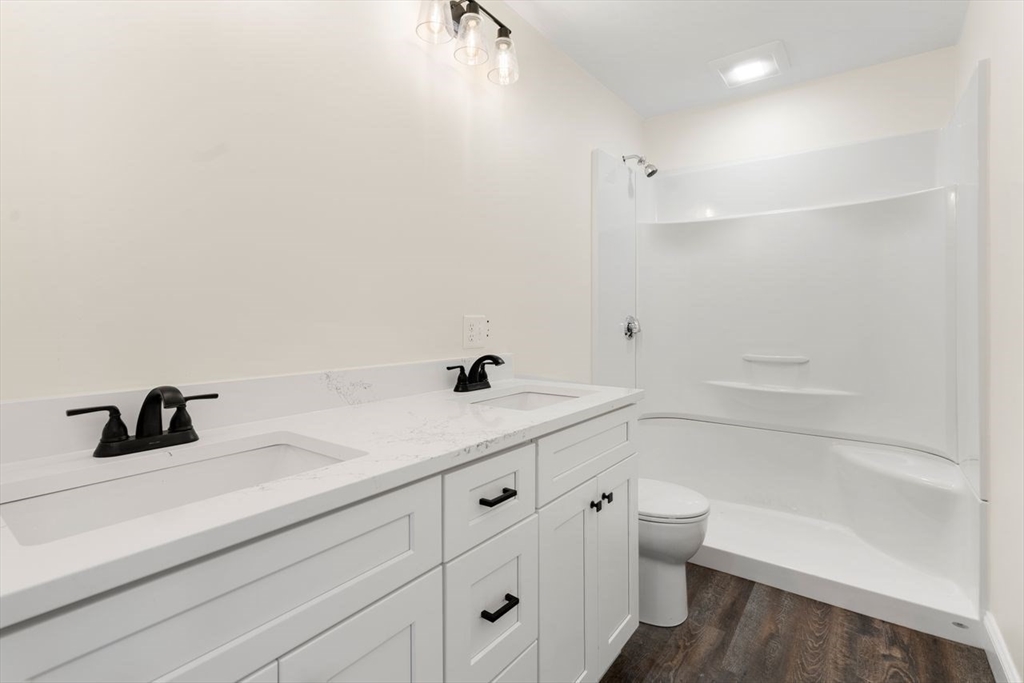 52 Freeman Street Avon, MA 02322 - Photo 14 of 17 a bathroom with a sink a toilet and vanity