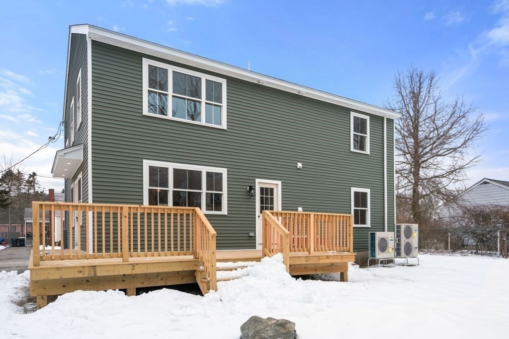 52 Freeman Street Avon, MA 02322 - Photo 17 of 17 a view of a house with a wooden deck