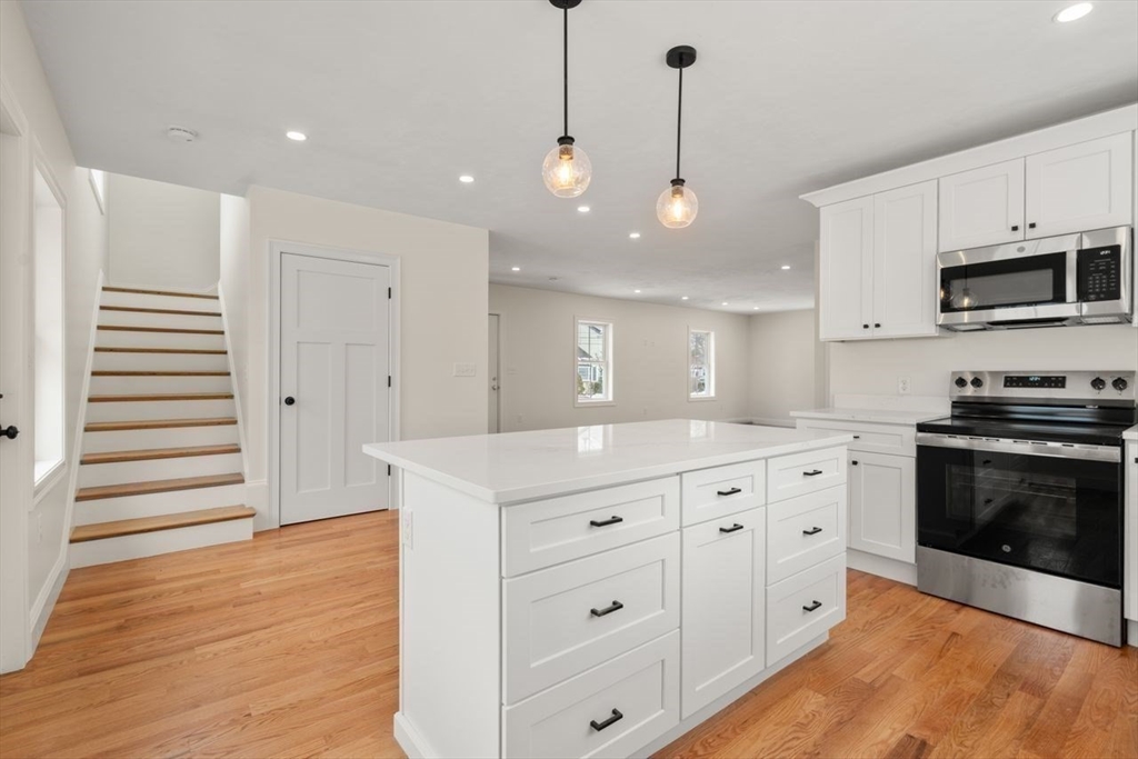52 Freeman Street Avon, MA 02322 - Photo 5 of 17 a large kitchen with cabinets