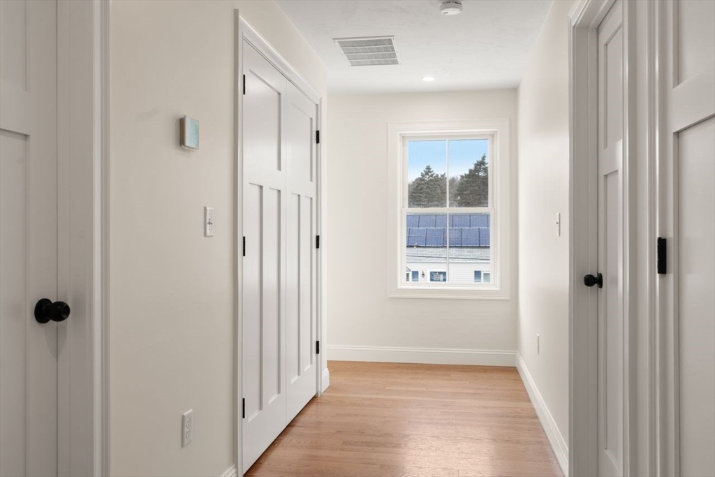 52 Freeman Street Avon, MA 02322 - Photo 9 of 17 a view of a bathroom with a bathtub and shower