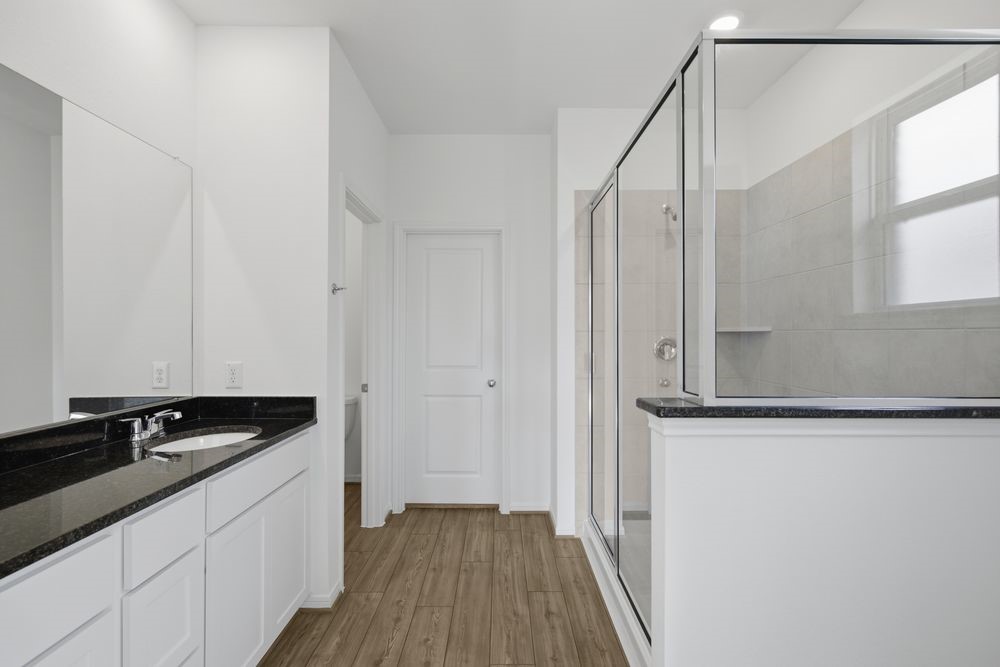5607 Buttonbush Court Rosenberg, TX 77471 - Photo 12 of 37 a kitchen with a sink and cabinets