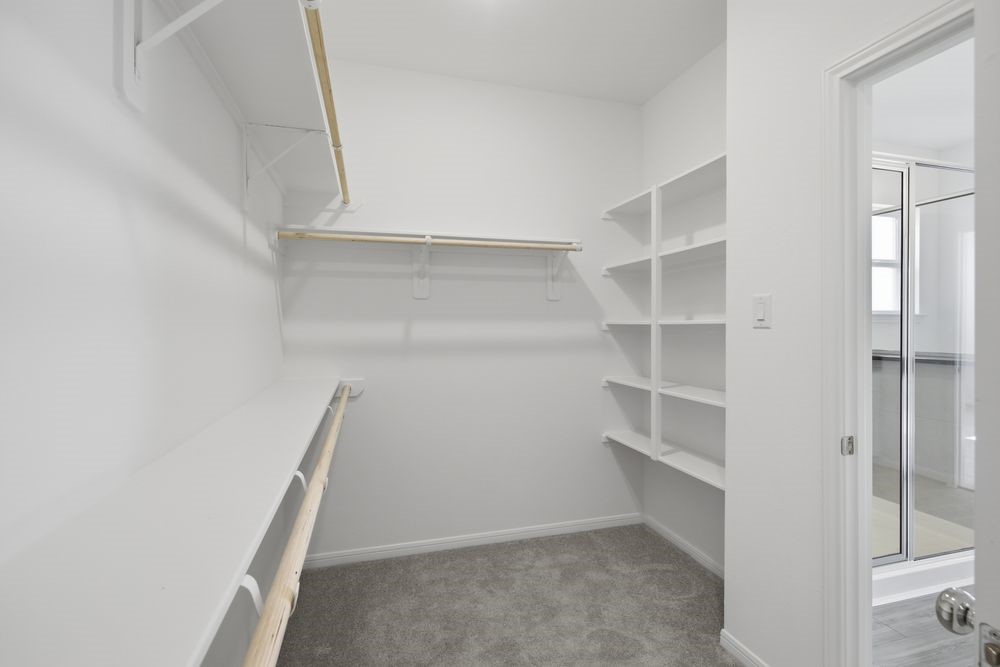 5607 Buttonbush Court Rosenberg, TX 77471 - Photo 14 of 37 a view of an empty walk in closet