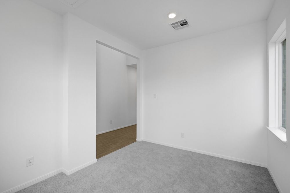 5607 Buttonbush Court Rosenberg, TX 77471 - Photo 18 of 37 an empty room with windows